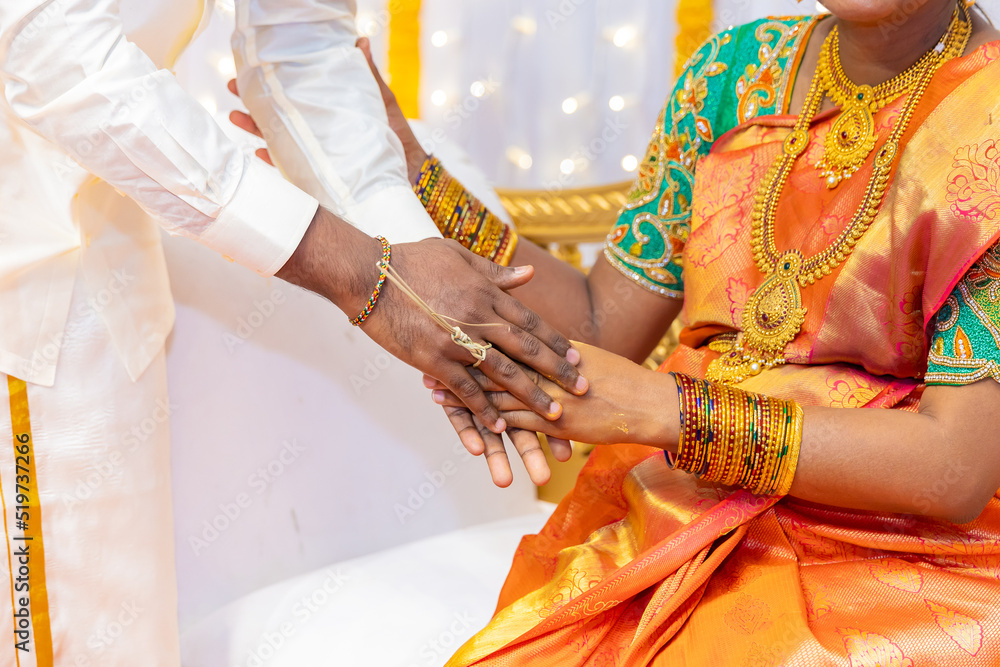 South Indian Tamil married couple's holding hands close up