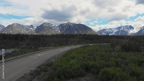 4K Drone Video of Mountain Peaks and Granite Creek near Denali National Park in Alaska on Sunny Summer Day photo