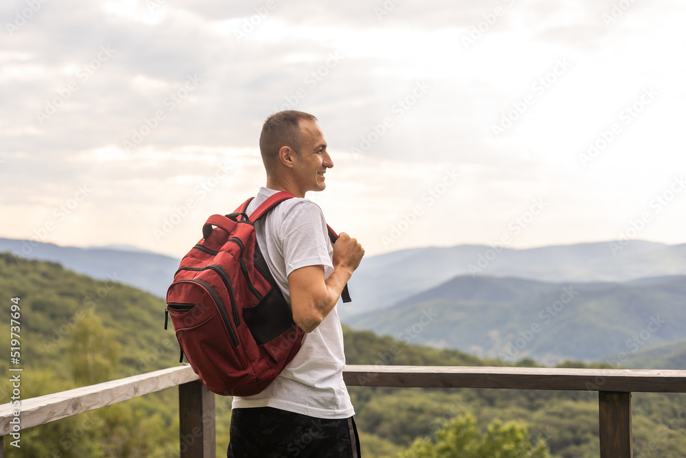 Obraz premium Hiker cheering elated and blissful after hiking