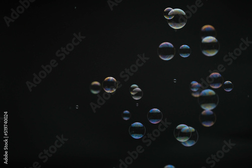 Wallpaper Mural Flying soap bubbles on black background. Abstract soap bubbles with colorful reflections. Soap bubbles in motion background. Torontodigital.ca