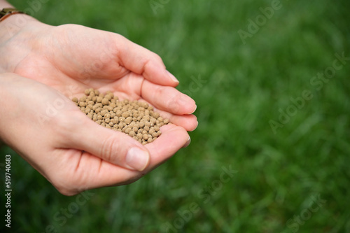 Farmer Hands Spreading Organic Universal Fertilizer