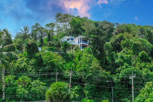 Villa Mansion in Phuket Mountains over looking Karon Beach lovely Skies Sunset over Patong Pa Tong Beach in Phuket island Thailand. Lovely lush green mountains colourful skies