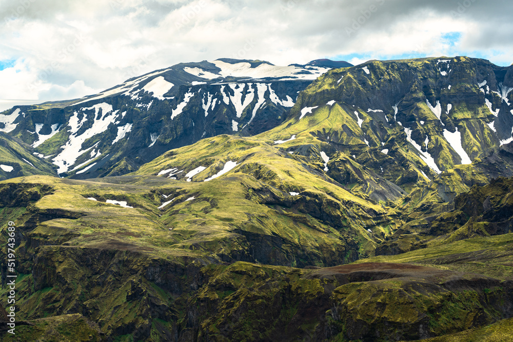 Green mountain with moss rough texture and snow covered in Icelandic highlands at Iceland Green mountain with moss rough texture and snow covered in Icelandic highlands at Iceland