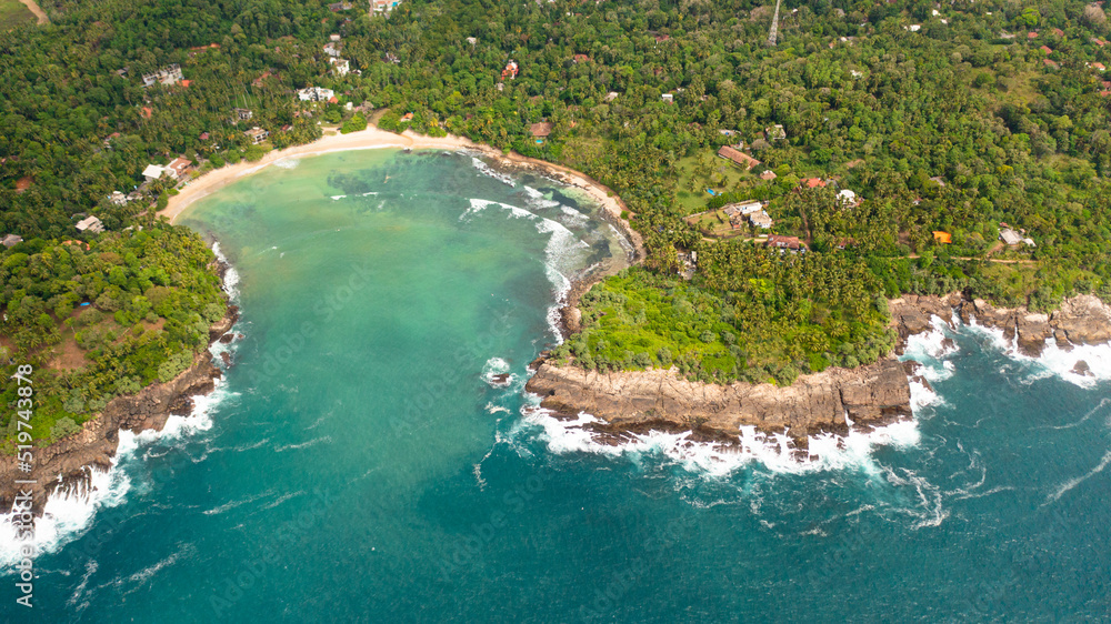 Aerial drone of beach in the bay, a place for surfing. Hiriketiya beach, Sri Lanka.