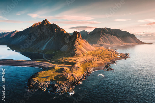 Spectacular Mount Eystrahorn in the Krossasnesfjall mountain range and sunlight shine in the morning on coastline in summer at East of Iceland