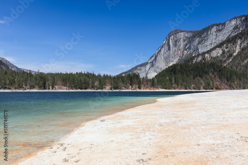 An alpine, freshwater lake Tovel, surrounded by forested mountains, Ville d'Anaunia, Trentino, Italy