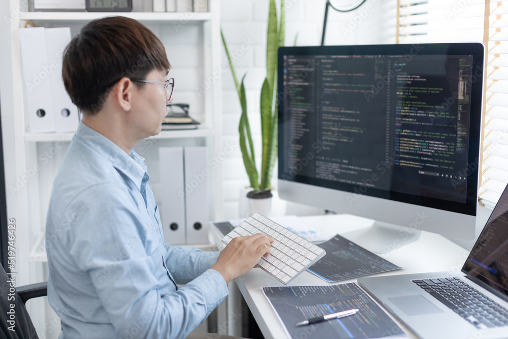 Professional development programmers are sit on a desk with work equipment such as: computer-laptop-tablet. for working in programming or writing code on website, HTML, javascript, Software. Professional development programmers are sit on a desk with work equipment such as: computer-laptop-tablet. for working in programming or writing code on website, HTML, javascript, Software.