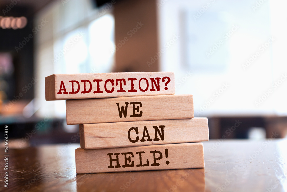 Wooden blocks with words 'Addiction? We can help'. Wooden blocks with words 'Addiction? We can help'.
