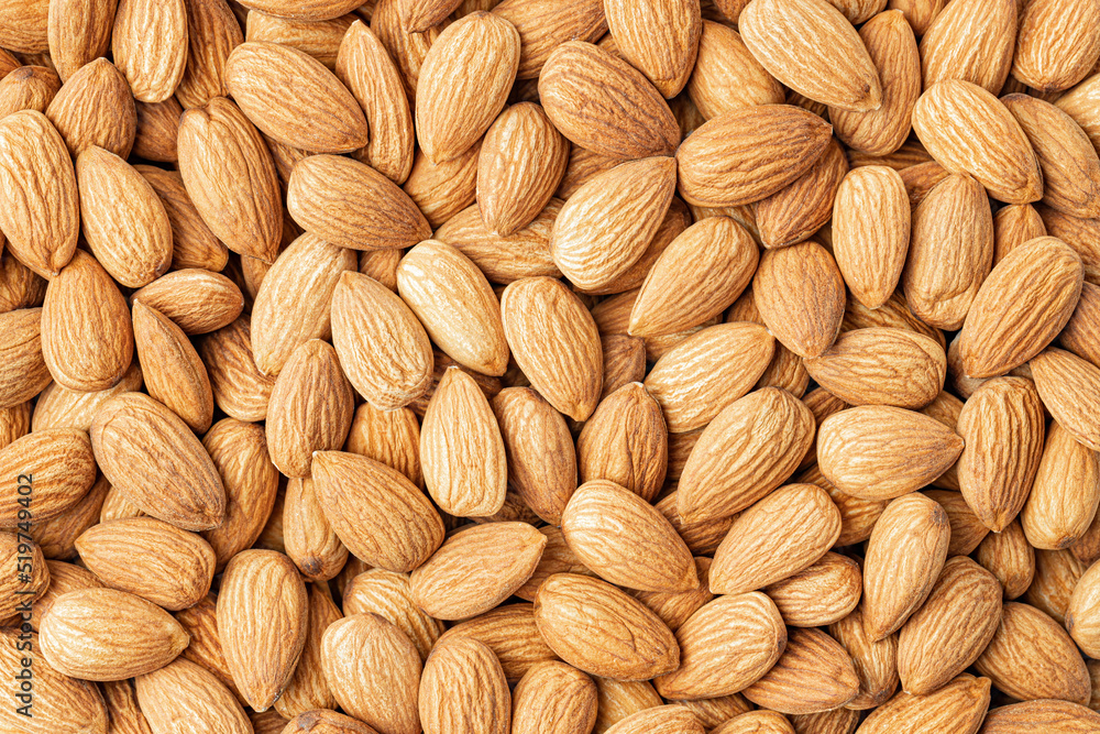 Fototapeta premium Almond. Almond background. Whole bulk almonds.
