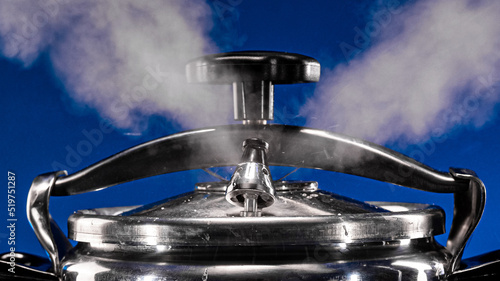 Pressure cooker whistles in the kitchen. Close-up.