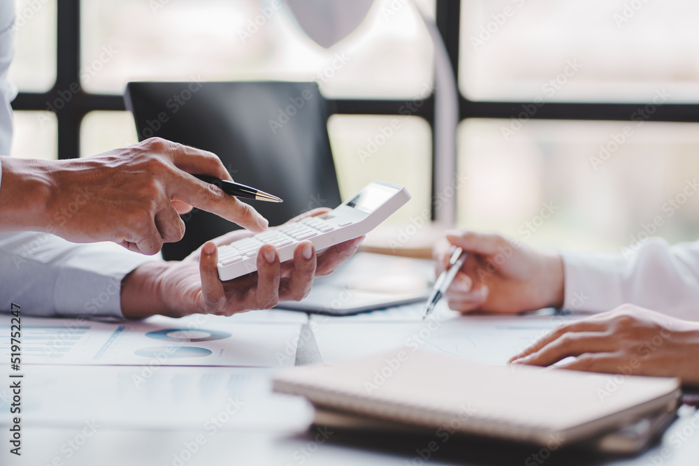 The financiers are calculating personal taxes for their customers. The financiers are calculating personal taxes for their customers.
