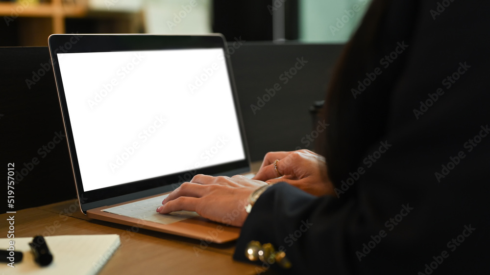Close up view businesswoman hands typing on laptop computer, working at modern office Close up view businesswoman hands typing on laptop computer, working at modern office