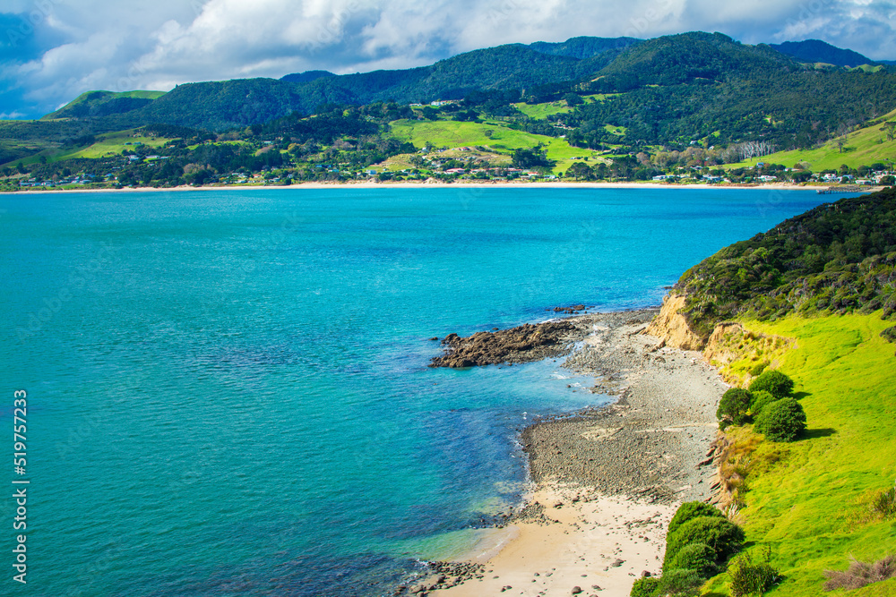 Aerial view over Hokianga Harbour surrounded by lush green hills and sandy beaches. Iconic New Zealand, Northland