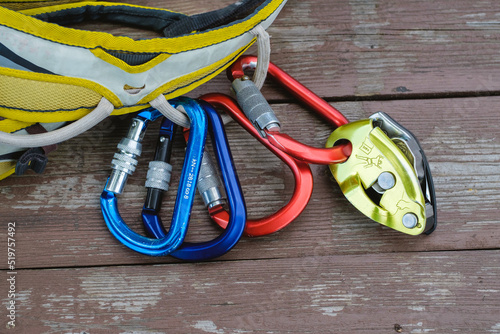 Climbing equipment on wooden background