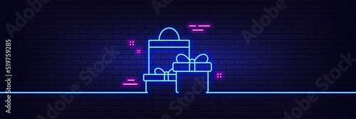 Neon light glow effect. Gift boxes with bag line icon. Present or Sale sign. Birthday Shopping symbol. Package in Gift Wrap. 3d line neon glow icon. Brick wall banner. Shopping outline. Vector
