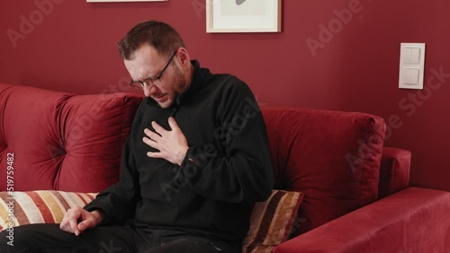 The man has a heart attack and is calling for help.