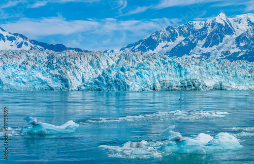 A view of icebergs in front of the snout of the Hubbard Glacier in Alaska in summertime photo