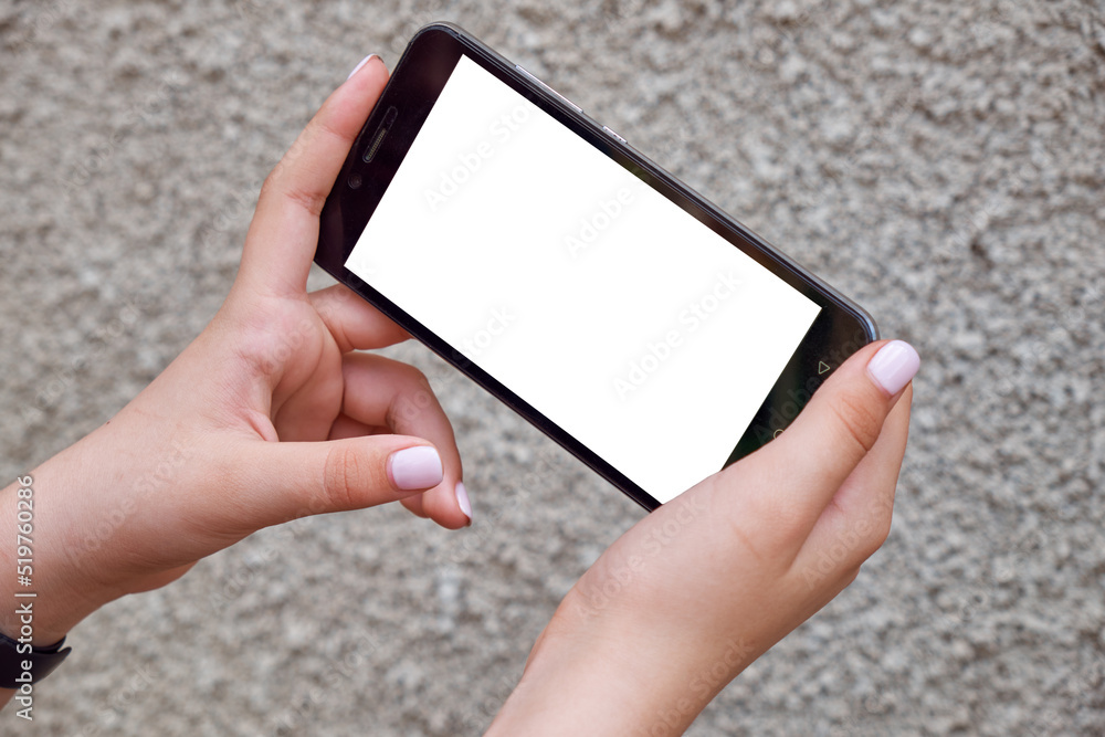 Young girl holding smartphone with white screen
