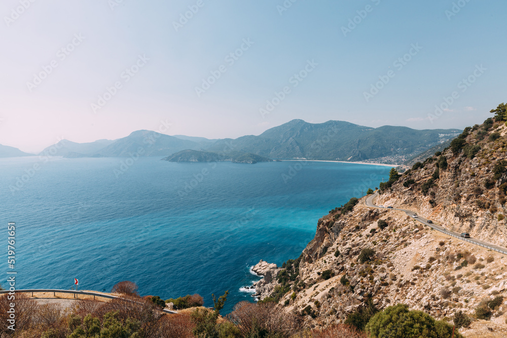 View to Blue Lagoon beach.. Aerial view of seascape in Oludeniz, Turkey. Sea and Mountains around turquoise water. Travel destination.
