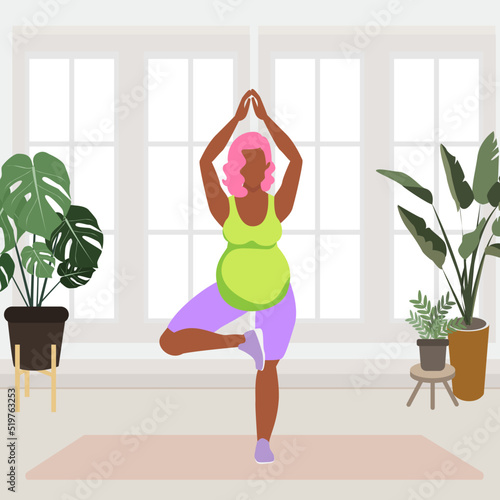 Young pregnant woman doing yoga. Tree pose