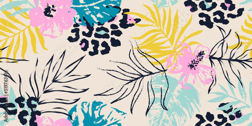 Seamless pattern with tropical leaves and hand drawn leopard spots. Floral background for the design of textiles, covers, wallpapers, fabric, promotional material and more. Vector illustration