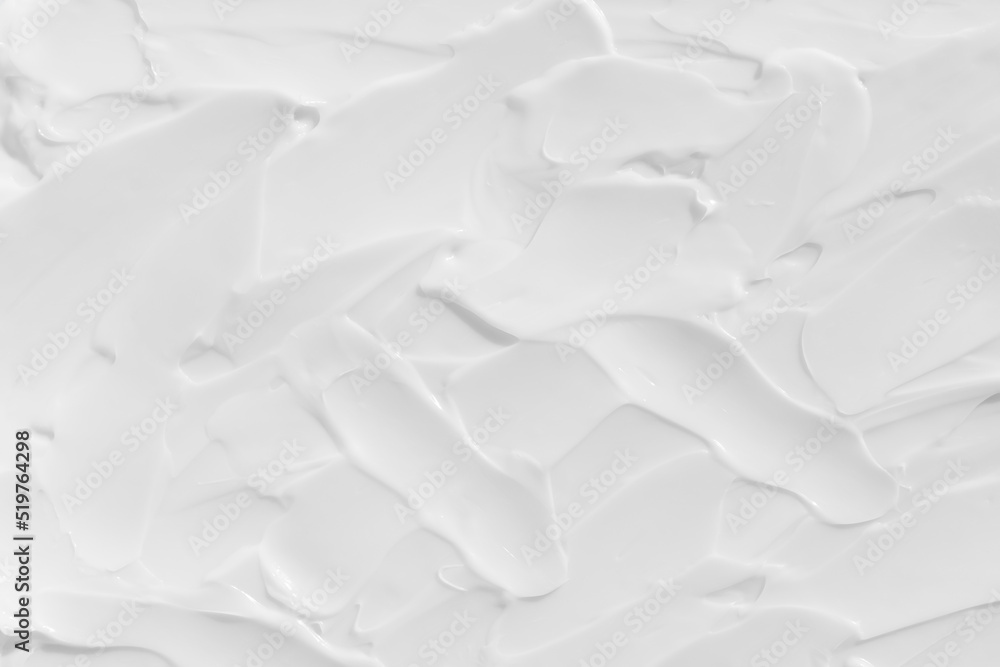 The texture of the white cream. Cosmetic background. Cosmetic product for body care. Wellness and beauty concept. The texture of the white cream. Cosmetic background. Cosmetic product for body care. Wellness and beauty concept.