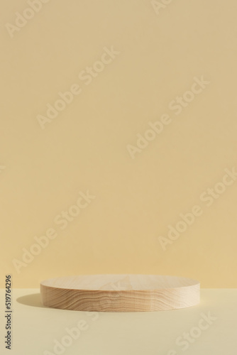 Fototapeta Naklejka Na Ścianę i Meble -  Cylindrical wooden scene on beige background. Premium podium for advertising your product. Minimal backdrop for product presentation. Showcase, display case.