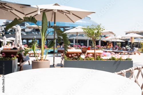 Table empty background in outdoor cafe   modern restaurant background.Front view. . Dining table. Brochure background.Bar outside in summer vacation 