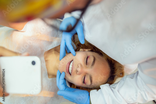 Happy girl lying in dental chair. 