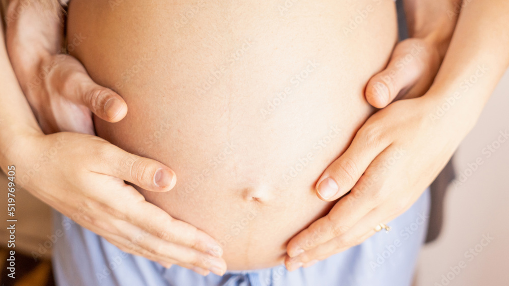 Pregnant hands woman belly. Happy pregnancy woman and husband hugging pregnant belly. Concept maternity, pregnancy, childbirth. Pregnant hands woman belly. Happy pregnancy woman and husband hugging pregnant belly. Concept maternity, pregnancy, childbirth.
