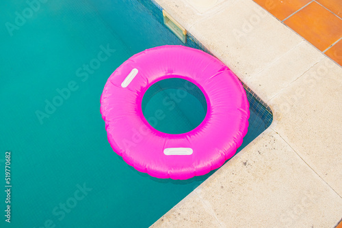 Valokuva view from above of a pink floater in a swimming pool