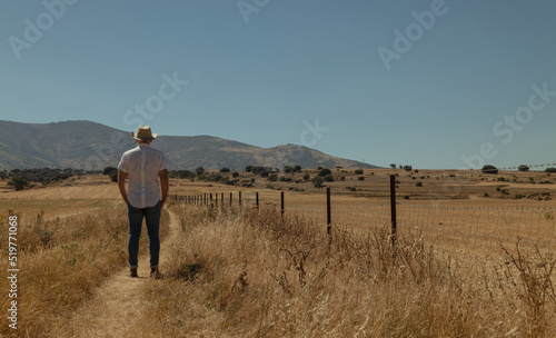Adult man in cowboy hat in fields. Castilla y Leon, Spain © WeeKwong
