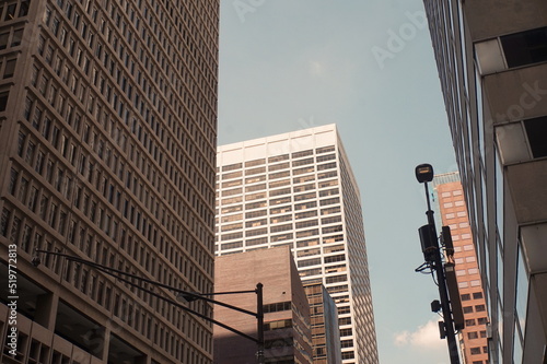 Fotografía Modern Brick and Morter Skyscrapers with Windows on Summer Day
