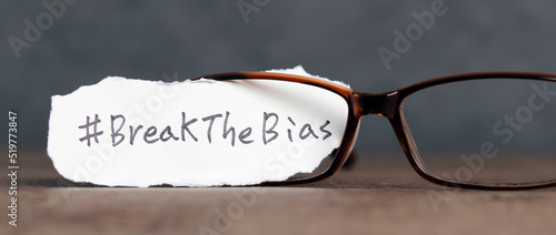 Torn paper with the word ‘BreakTheBias' written on it. Break the bias campaign.
 photo