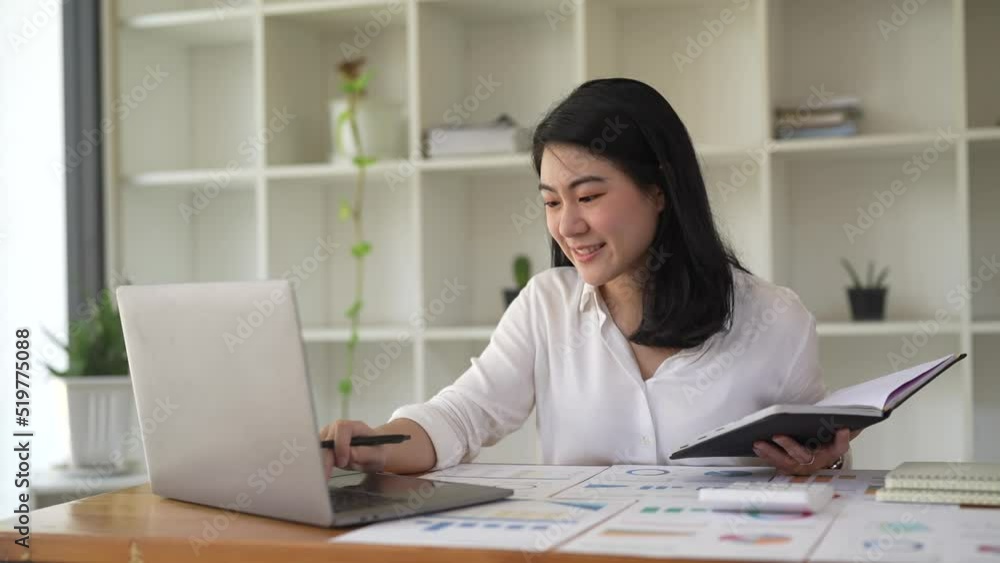 Happy asian woman making a video call using laptop for business meeting. slow Happy asian woman making a video call using laptop for business meeting. slow