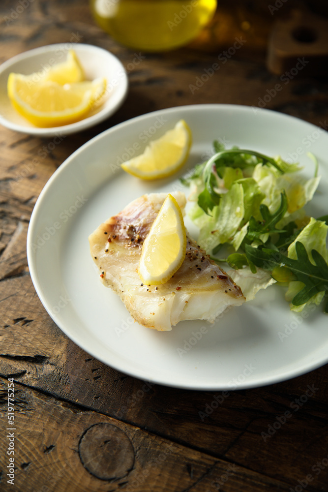 Roasted cod fillet with lemon and salad Roasted cod fillet with lemon and salad