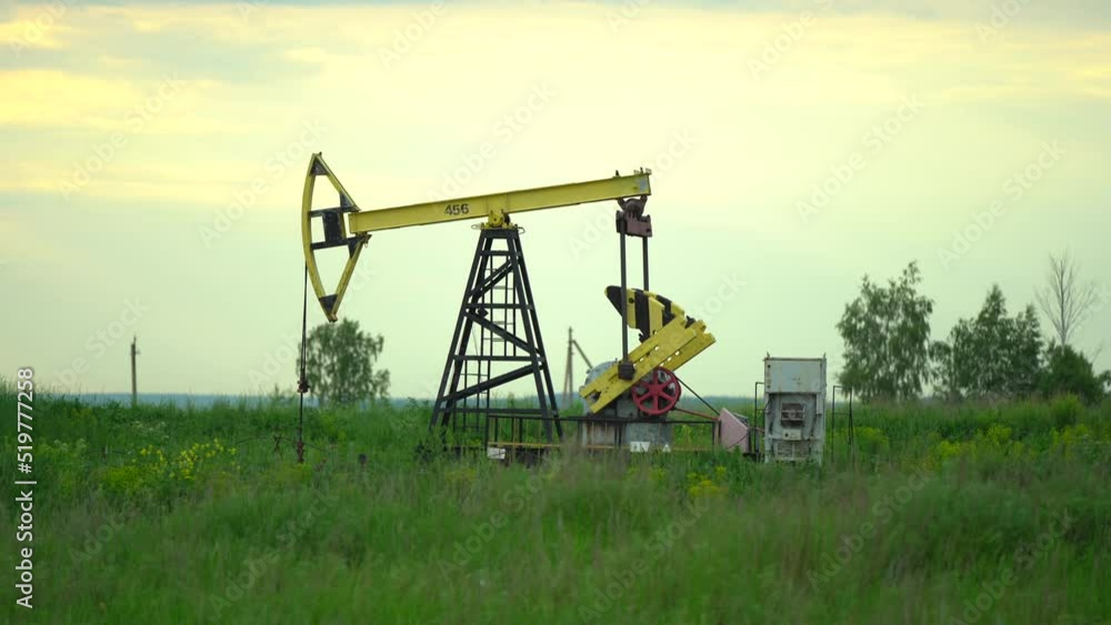 Oil Well Pump Jack Extracting Petroleum. Working Oil Pump Jack Silhouette Against The Sky and Sun. Extraction of Petroleum. Fossil Fuel Energy. Oil Well Pump Jack Extracting Petroleum. Working Oil Pump Jack Silhouette Against The Sky and Sun. Extraction of Petroleum. Fossil Fuel Energy.