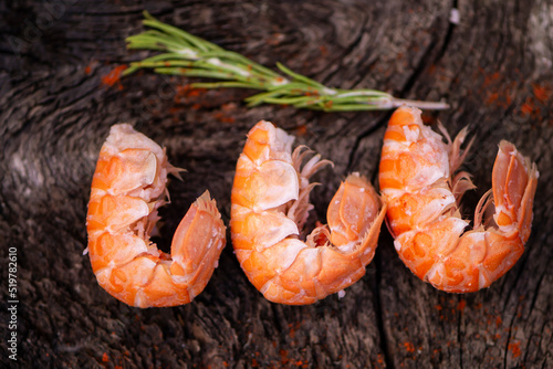 boiled large shrimp on a dark wooden background