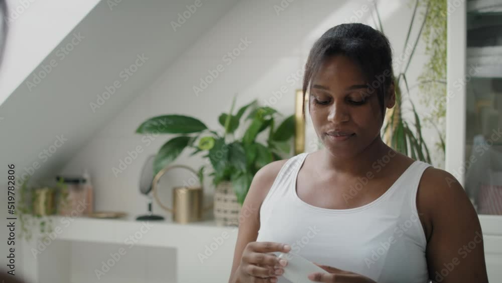 African-American woman feeling fresh after applying roll on antiperspirant. Shot with RED helium camera in 4K. African-American woman feeling fresh after applying roll on antiperspirant. Shot with RED helium camera in 4K.