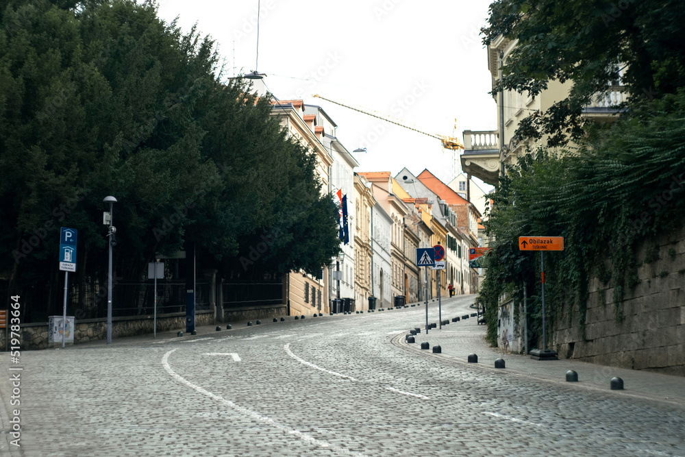 Empty asphalt road and old historic street in downtown of Zagreb, Croatia. Translation from