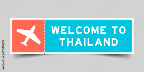 Orange and blue color ticket with plane icon and word welcome to thailand on gray background