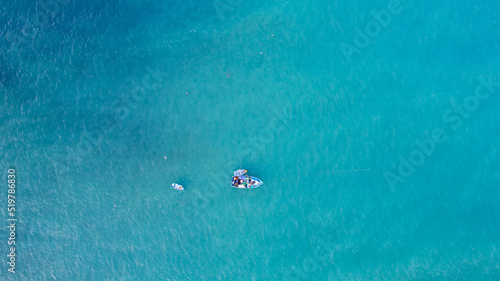 Fotografie Fishing boat on the turquoise sea