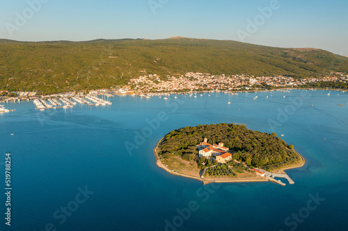 Aerial view of Kosljun monastery with Punat town in the background, Krk island, Croatia