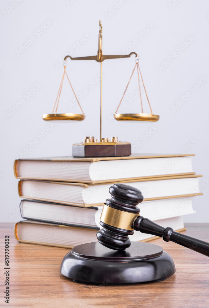 Judge's hammer and scale on the table, legal issues Judge's hammer and scale on the table, legal issues