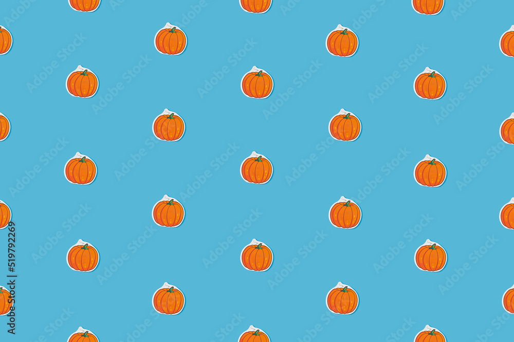 Autumn pattern with small pumpkins on a blue background. Abstract concept idea. Autumn pattern with small pumpkins on a blue background. Abstract concept idea.