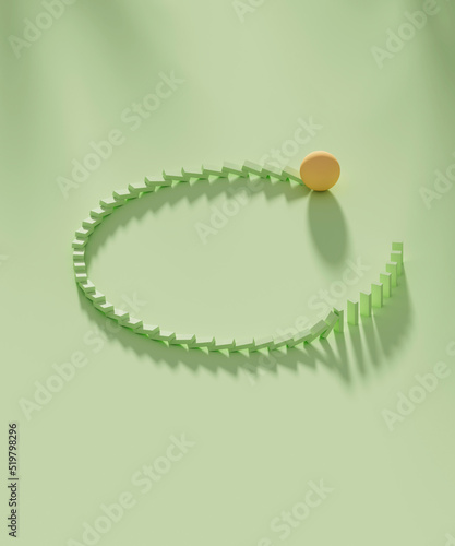 Studio shot of yellow sphere knocking down domino pieces organized in circle shape