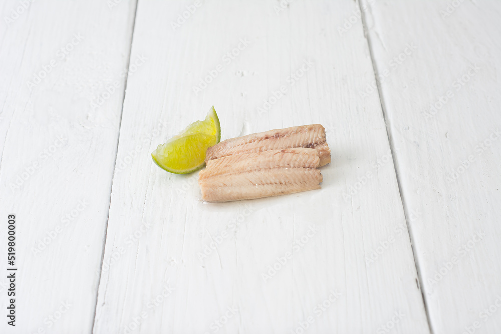 Sardine in a can. Boneless sardines in oil. Peppers, tomatoes, lemons