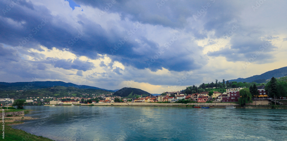 Naklejka premium Panoramic View in the Rainy Day to the Višegrad with the Rainbow over the Drina River, Bosnia and Herzegovina