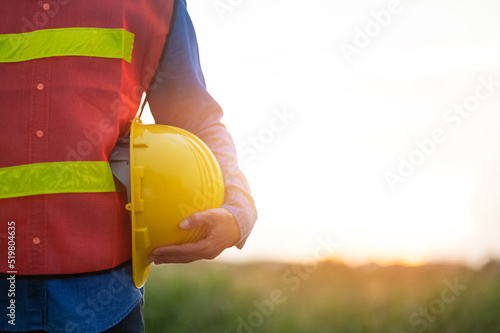 Engineer holding hard hat construction worker professional safety work industry building person manager service photo