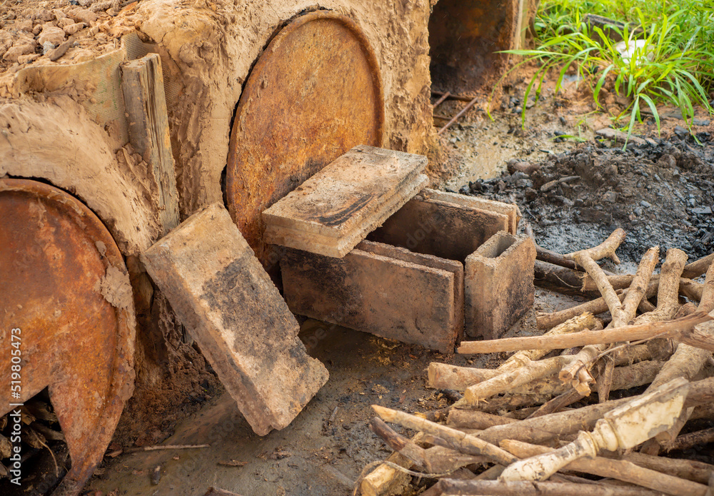 A kiln that uses bricks stacked next to a pile of firewood. thai stype, DIY. A kiln that uses bricks stacked next to a pile of firewood. thai stype, DIY.